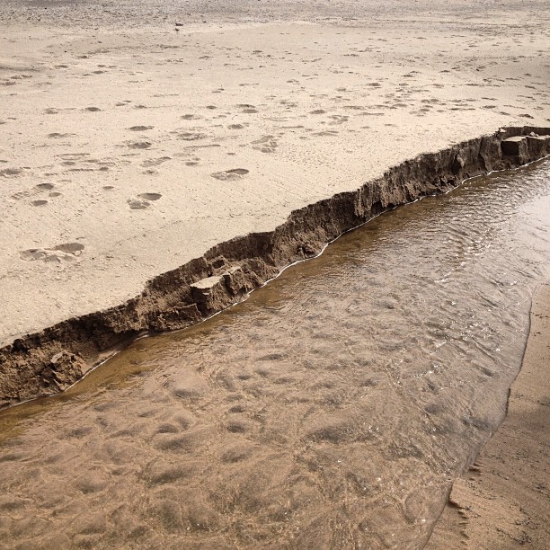 Sand cut by the recent rains.